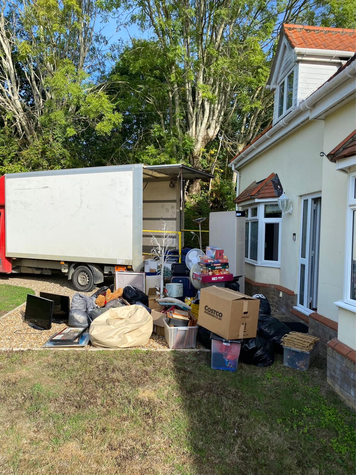 Household items cleared out onto the drive during a house clearance