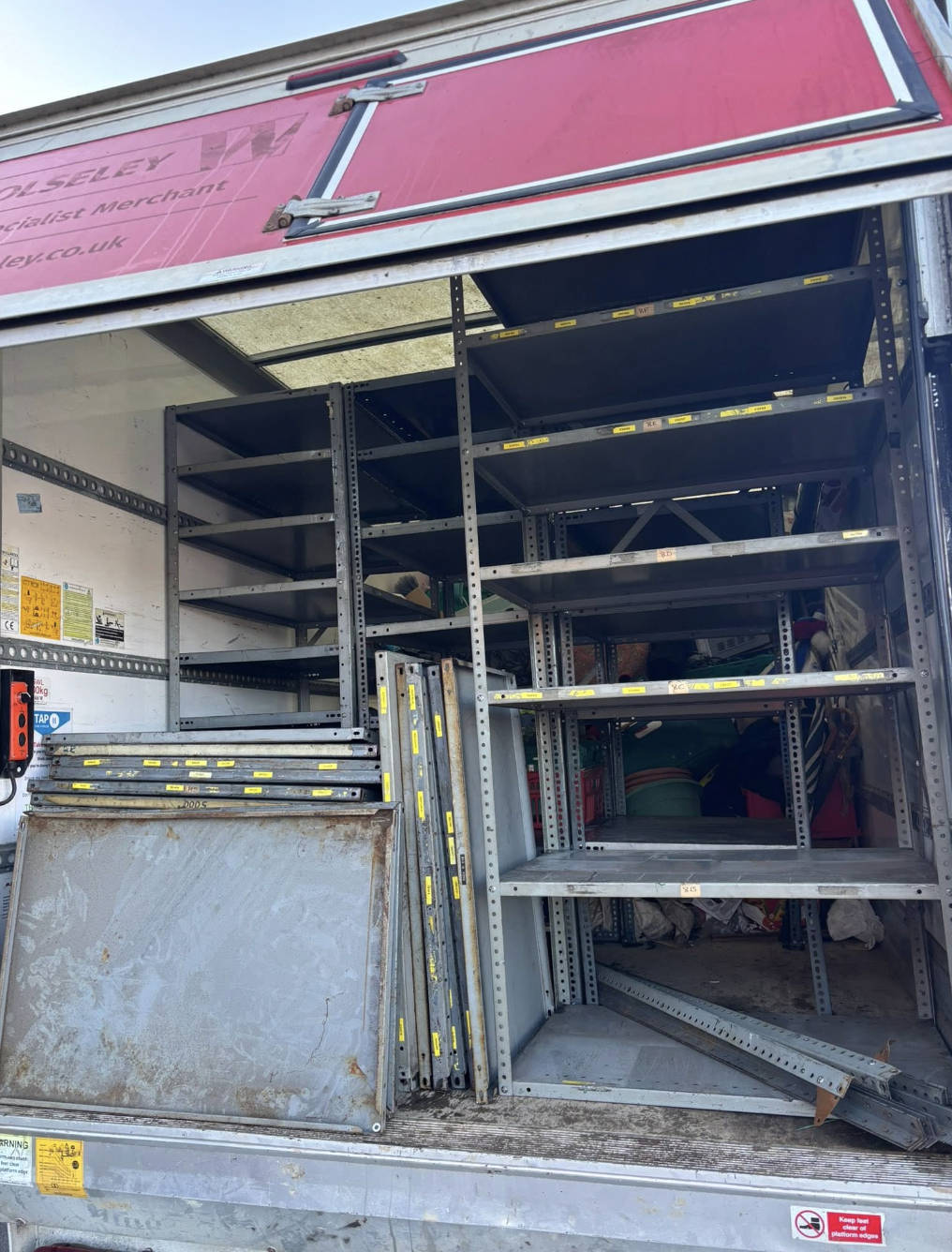 Van interior showing racking part-loaded during a removal
